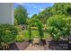 Beautiful backyard with a stone pathway leading to a garden arch at 202 Caldwell Ln, Davidson, NC 28036