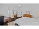 Spacious bedroom with hardwood floors, comfortable bed, and ample closet space at 202 Caldwell Ln, Davidson, NC 28036