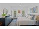 Bright bedroom with a comfortable bed, stylish decor, and access to a balcony for fresh air and natural light at 202 Caldwell Ln, Davidson, NC 28036
