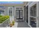 Relaxing deck area with a small table and chairs, perfect for enjoying outdoor living at 202 Caldwell Ln, Davidson, NC 28036