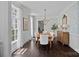 Elegant dining room with hardwood floors, decorative wallpaper, and natural light creating a sophisticated ambiance at 202 Caldwell Ln, Davidson, NC 28036