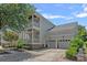 Spacious home with an attached two-car garage and double porches, offering ample parking and outdoor living space at 202 Caldwell Ln, Davidson, NC 28036