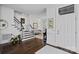 Elegant foyer showcasing a staircase, hardwood floors, and ample natural light creating a welcoming ambiance at 202 Caldwell Ln, Davidson, NC 28036
