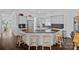 Spacious kitchen island with seating, granite countertops, stainless appliances, and hardwood floors at 202 Caldwell Ln, Davidson, NC 28036