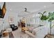 Bright living room with hardwood floors, comfortable seating, and a view of the kitchen at 202 Caldwell Ln, Davidson, NC 28036