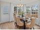 Charming dining room with a wood table set for six and large windows with backyard views at 203 Putnam St, Shelby, NC 28152