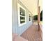 Spacious front porch with wood flooring and railing; an inviting spot for outdoor seating and enjoyment at 203 Putnam St, Shelby, NC 28152