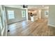 Bright living room open to the kitchen featuring hardwood floors, natural light, and a modern design at 203 Putnam St, Shelby, NC 28152