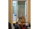 Untidy bathroom as seen through a doorway, featuring a shower and cluttered vanity at 2056 Evergreen Dr, Newton, NC 28658