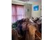 Disorganized bedroom with clothes and yarn piled on the bed at 2056 Evergreen Dr, Newton, NC 28658