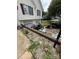 A cluttered paved driveway leading to attached garages at 2056 Evergreen Dr, Newton, NC 28658