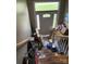 Cluttered entryway with boxes and personal items blocking the stairs at 2056 Evergreen Dr, Newton, NC 28658
