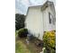 Side view of a house with vinyl siding and some plants at 2056 Evergreen Dr, Newton, NC 28658