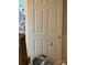 Interior white door with a hole and damage to the paint at 2056 Evergreen Dr, Newton, NC 28658