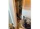 Cluttered hallway featuring mold, personal items, and a view of a room's mess at 2056 Evergreen Dr, Newton, NC 28658