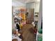 Messy kitchen featuring stainless steel refrigerator and pale green cabinetry at 2056 Evergreen Dr, Newton, NC 28658