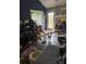 Untidy living room filled with furniture and scattered belongings at 2056 Evergreen Dr, Newton, NC 28658