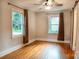 Bedroom with ample natural light and original hardwood floors at 2115 Arnold Dr, Charlotte, NC 28205