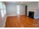 Light-filled living room with beautiful hardwood floors, modern trim, and a view of the front yard at 2115 Arnold Dr, Charlotte, NC 28205