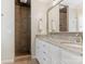 Bathroom with walk-in tile shower, granite countertops, and double sinks at 2141 Halford Pl, Charlotte, NC 28211