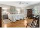 Serene primary bedroom features a neutral color palette and hardwood floors at 2141 Halford Pl, Charlotte, NC 28211