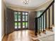 Bright foyer with wooden floors, black banister, and stylish double doors at 2141 Halford Pl, Charlotte, NC 28211