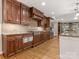 Updated kitchen with wood cabinetry, granite countertops, and stainless steel appliances at 2141 Halford Pl, Charlotte, NC 28211