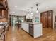 Open concept kitchen with center island, stainless dishwasher and breakfast bar at 2141 Halford Pl, Charlotte, NC 28211