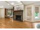 Cozy living room features a fireplace, natural light, and hardwood floors at 2141 Halford Pl, Charlotte, NC 28211