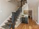 Elegant staircase with carpet runner and wood flooring at 2141 Halford Pl, Charlotte, NC 28211