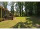 Expansive backyard with lush greenery and mature trees providing ample shade at 215 W Eastway Drive Dr, Charlotte, NC 28213