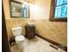 Bathroom features tile flooring, ornate mirror, and sink at 215 W Eastway Drive Dr, Charlotte, NC 28213