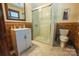 Modern bathroom featuring walk-in shower and sink with cabinet at 215 W Eastway Drive Dr, Charlotte, NC 28213