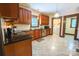 Well-lit kitchen featuring granite countertops, beautiful cabinets, and modern appliances at 215 W Eastway Drive Dr, Charlotte, NC 28213