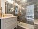 Modern bathroom featuring a walk-in shower with gray marble tiles, a white vanity, and a large mirror at 222 S Caldwell St # 2203, Charlotte, NC 28202