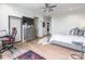 Bedroom featuring modern gamer-style decor and a large window, with a gaming desk and comfortable bed at 222 S Caldwell St # 2203, Charlotte, NC 28202