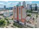 External view of 222 S Caldwell Street #2203 and surrounding cityscape under a bright blue sky at 222 S Caldwell St # 2203, Charlotte, NC 28202