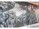 Hallway featuring gray walls with a mural and detailed architecture, and a smooth baseboard at 222 S Caldwell St # 2203, Charlotte, NC 28202