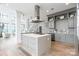 Open kitchen with modern appliances, stylish cabinetry, a spacious island, and an open concept design at 222 S Caldwell St # 2203, Charlotte, NC 28202
