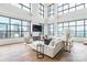 Spacious living room with floor-to-ceiling windows providing abundant natural light and city vistas at 222 S Caldwell St # 2203, Charlotte, NC 28202