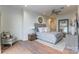 This main bedroom features a seating area, wooden floors and ensuite bath access at 222 S Caldwell St # 2203, Charlotte, NC 28202