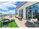 Spacious rooftop terrace features outdoor seating, a fire pit, city views and access to the building at 222 S Caldwell St # 2203, Charlotte, NC 28202