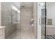 This luxury shower has a glass door, built-in bench, and rainfall showerhead at 222 S Caldwell St # 2203, Charlotte, NC 28202