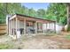 Spacious backyard with a covered patio perfect for outdoor dining and relaxation at 2279 Cedar Oak Cir, Gastonia, NC 28052