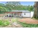 Spacious backyard with a covered patio perfect for outdoor dining and relaxation at 2279 Cedar Oak Cir, Gastonia, NC 28052