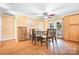 Dining room with hardwood floors, a modern chandelier, and a door to the backyard at 2279 Cedar Oak Cir, Gastonia, NC 28052