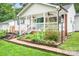 Charming home's front porch with brick accents and landscaped yard at 2279 Cedar Oak Cir, Gastonia, NC 28052