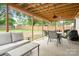 Covered patio featuring comfortable seating and dining areas, ideal for entertaining at 2279 Cedar Oak Cir, Gastonia, NC 28052