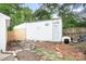 Backyard shed provides extra storage space and features decorative accents at 2279 Cedar Oak Cir, Gastonia, NC 28052
