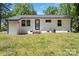 The backyard features a well manicured lawn and a view of the rear of the house at 2515 Danforth Ln, Charlotte, NC 28208
